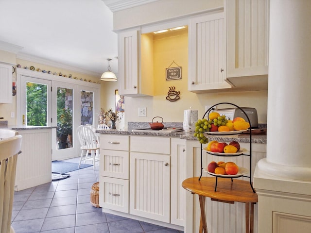 16 Davis Point Rd, Wayne, ME 04284 - kitchen with light tile patterned floors, ornamental molding, white cabinetry, and light countertops