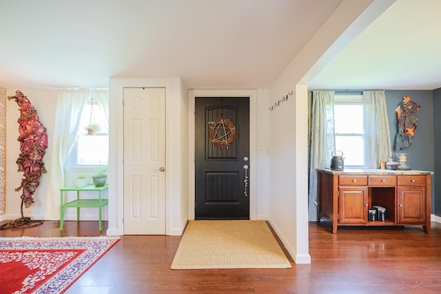 555 Meadow Rd, Topsham, ME 04086 - entryway featuring dark wood-style floors and baseboards