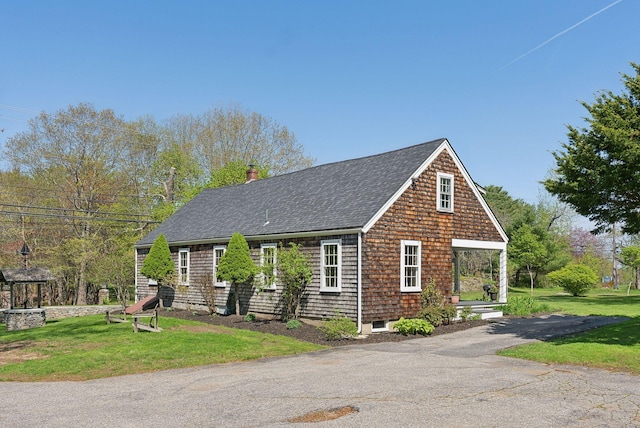 378 Pool St, Biddeford, ME 04005 - view of front of property featuring roof with shingles, a front lawn, and a chimney