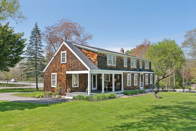 378 Pool St, Biddeford, ME 04005 - view of front of property with a porch, a front yard, and roof with shingles