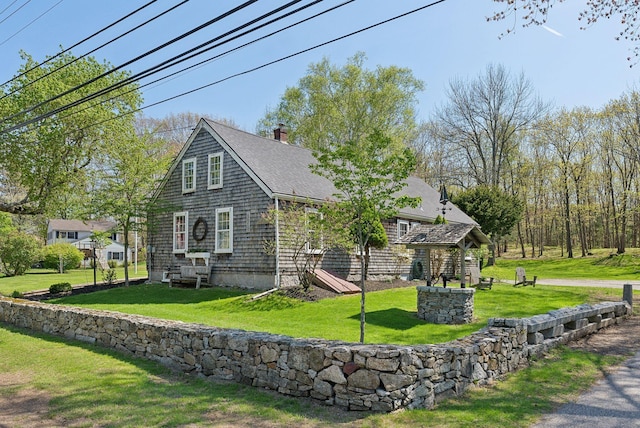378 Pool St, Biddeford, ME 04005 - back of property featuring roof with shingles, a chimney, and a lawn