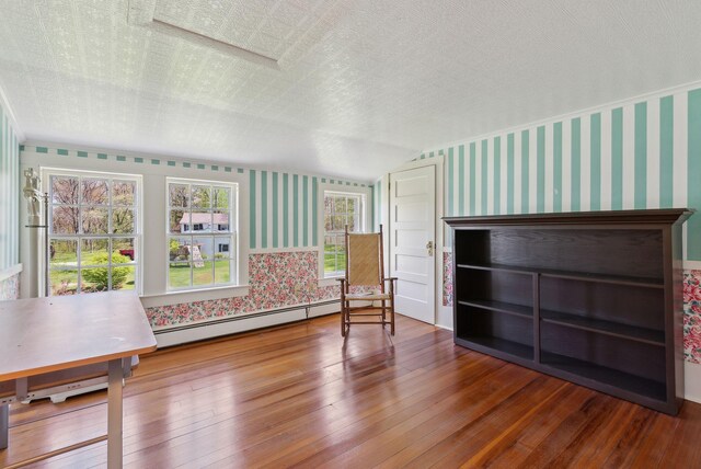 378 Pool St, Biddeford, ME 04005 - unfurnished room with wallpapered walls, baseboard heating, and hardwood / wood-style floors