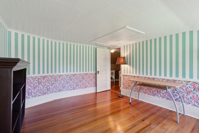 378 Pool St, Biddeford, ME 04005 - bonus room with wallpapered walls, attic access, wood finished floors, and baseboards