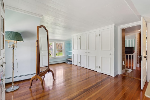 378 Pool St, Biddeford, ME 04005 - unfurnished bedroom featuring hardwood / wood-style floors and a baseboard heating unit