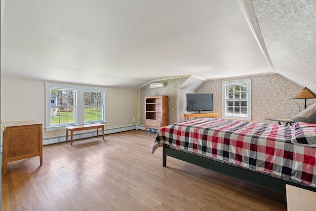 378 Pool St, Biddeford, ME 04005 - bedroom featuring a baseboard radiator, wallpapered walls, lofted ceiling, wood-type flooring, and a wall mounted AC