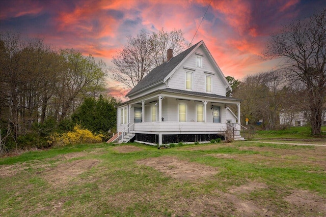 127 Harbor Rd, Friendship, ME 04547 - view of front of house featuring a porch, a chimney, a lawn, and a shingled roof
