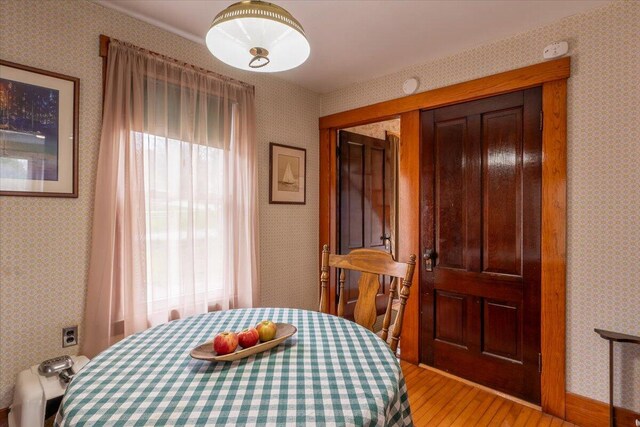 127 Harbor Rd, Friendship, ME 04547 - dining area featuring light wood-type flooring and wallpapered walls