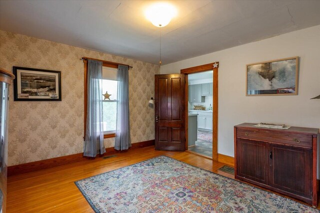 127 Harbor Rd, Friendship, ME 04547 - foyer entrance featuring light wood-style floors, baseboards, and wallpapered walls