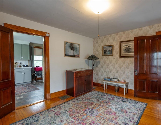 127 Harbor Rd, Friendship, ME 04547 - hall with hardwood / wood-style flooring, baseboards, and wallpapered walls