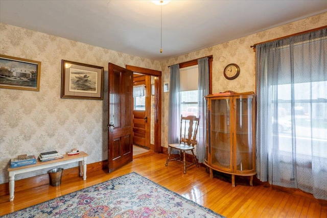 127 Harbor Rd, Friendship, ME 04547 - foyer entrance featuring hardwood / wood-style flooring, wallpapered walls, and baseboards