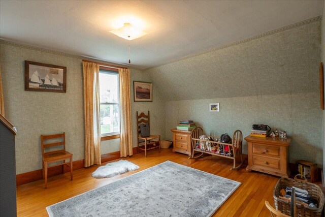 127 Harbor Rd, Friendship, ME 04547 - bedroom with wood finished floors, lofted ceiling, and wallpapered walls