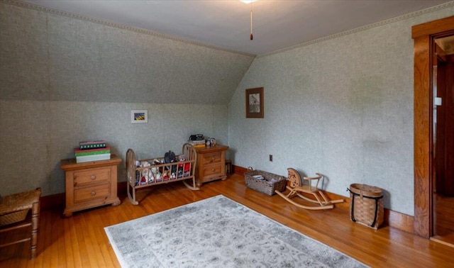 127 Harbor Rd, Friendship, ME 04547 - bedroom with wallpapered walls, wood finished floors, and lofted ceiling