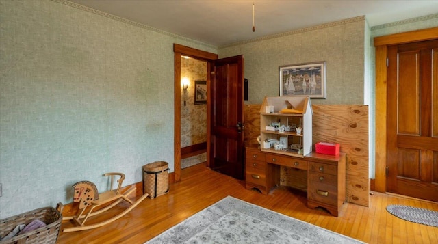 127 Harbor Rd, Friendship, ME 04547 - home office with wood finished floors, wallpapered walls, and ornamental molding
