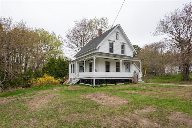 127 Harbor Rd, Friendship, ME 04547 - view of front of house featuring covered porch, a chimney, a front lawn, and roof with shingles