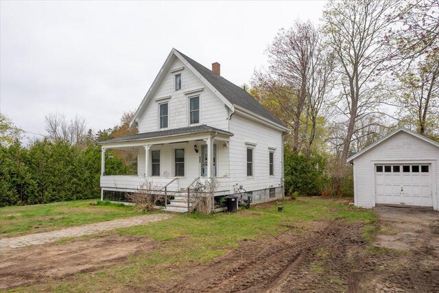 127 Harbor Rd, Friendship, ME 04547 - view of front facade featuring a porch, a chimney, an outbuilding, a detached garage, and roof with shingles