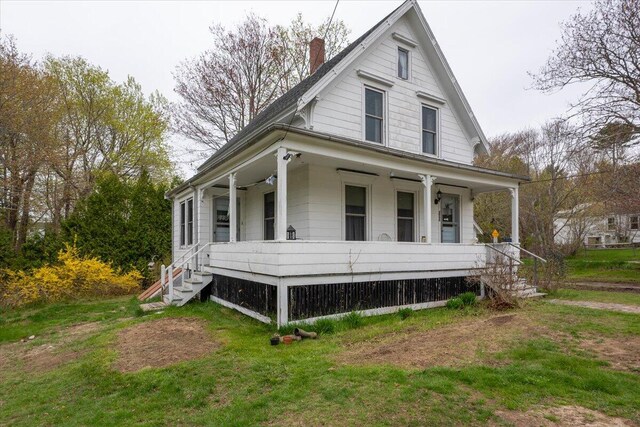 127 Harbor Rd, Friendship, ME 04547 - view of front facade with a porch, a chimney, and a front lawn