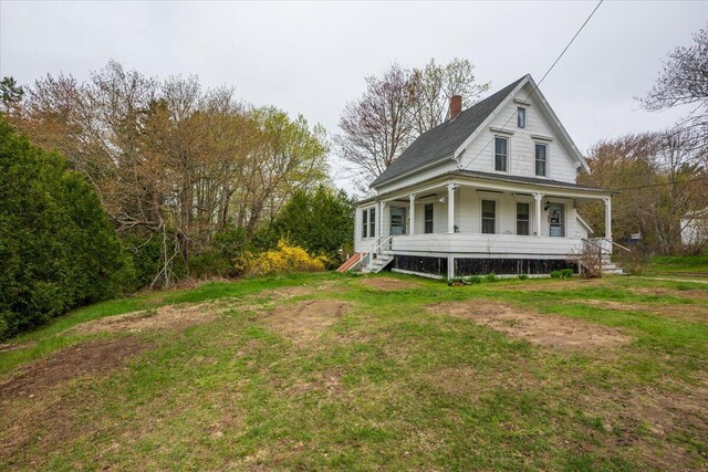 127 Harbor Rd, Friendship, ME 04547 - view of property exterior with a porch, a chimney, and a lawn