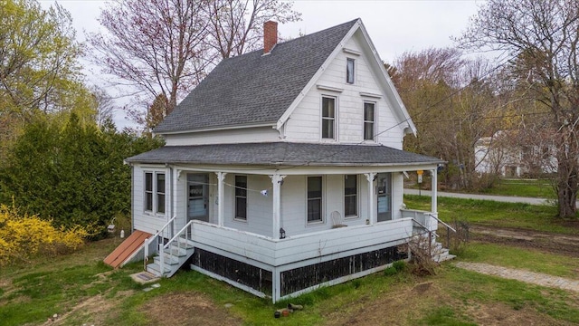 127 Harbor Rd, Friendship, ME 04547 - view of front facade with a porch, roof with shingles, and a chimney
