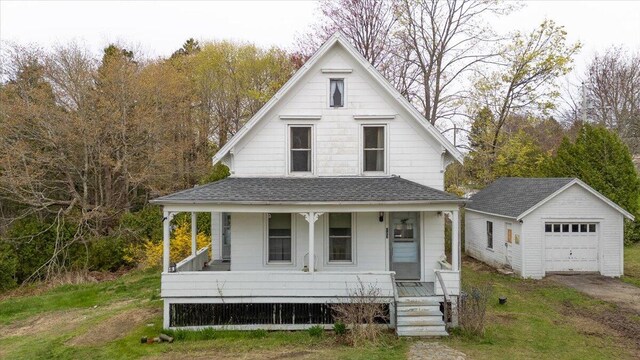 127 Harbor Rd, Friendship, ME 04547 - view of front of house with covered porch, an outdoor structure, a shingled roof, and a garage