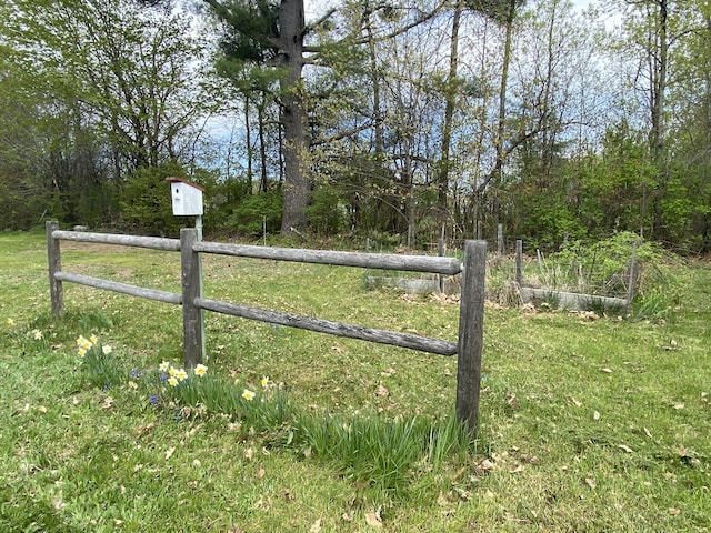 gate with fence and a wooded view