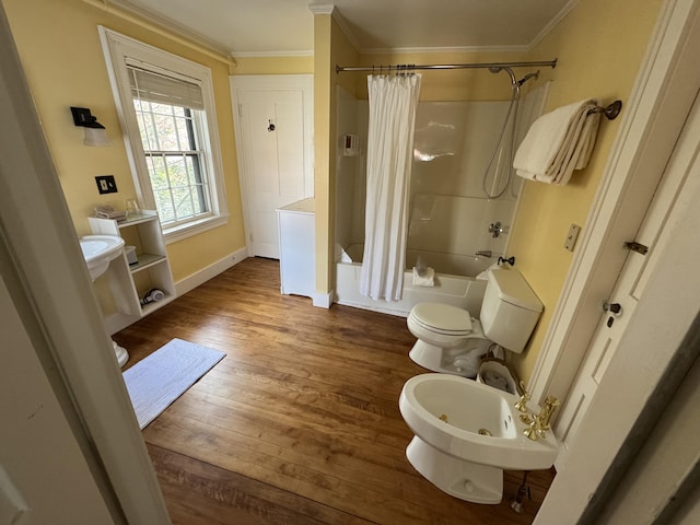 969 Washington St, Bath, ME 04530 - bathroom with ornamental molding, hardwood / wood-style flooring, baseboards, shower / bath combo with shower curtain, and toilet