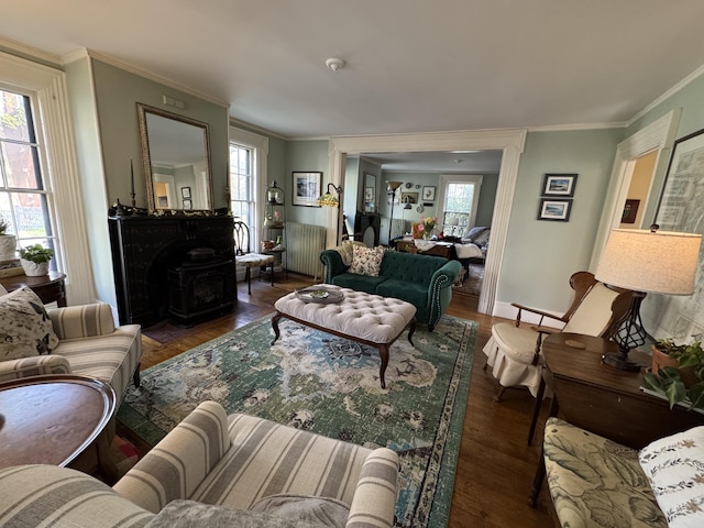 969 Washington St, Bath, ME 04530 - living room featuring a wood stove, ornamental molding, wood finished floors, and baseboards