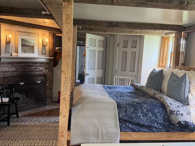 969 Washington St, Bath, ME 04530 - bedroom with a brick fireplace and beamed ceiling