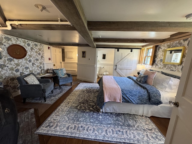 969 Washington St, Bath, ME 04530 - bedroom featuring wallpapered walls, wood finished floors, wainscoting, beamed ceiling, and a barn door