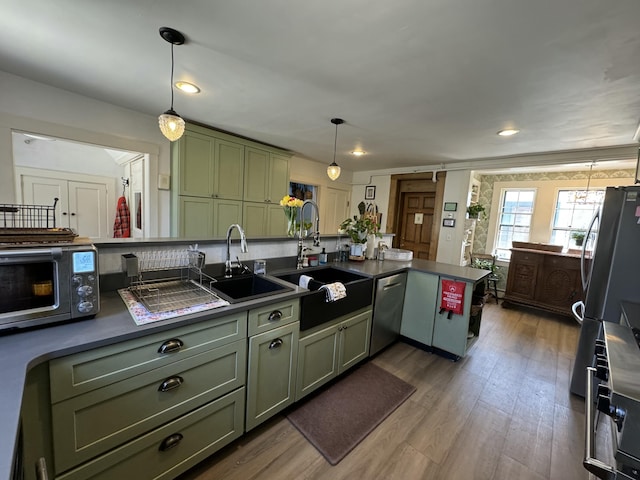 969 Washington St, Bath, ME 04530 - kitchen featuring green cabinets, appliances with stainless steel finishes, a sink, dark countertops, and recessed lighting