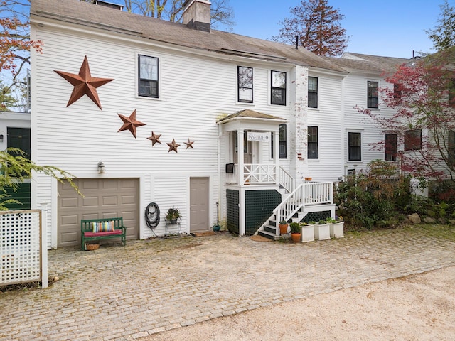 969 Washington St, Bath, ME 04530 - view of front facade featuring decorative driveway, a chimney, and a garage