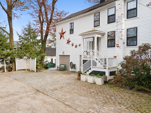 969 Washington St, Bath, ME 04530 - view of front of property featuring a garage, driveway, and a chimney