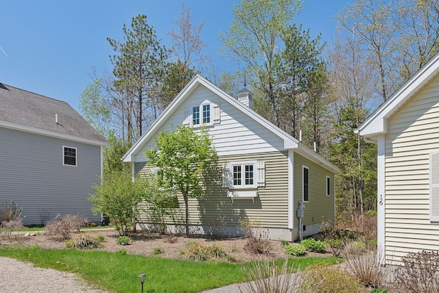 272 Mills Rd Unit 17, Kennebunkport, ME 04046 - view of property exterior with a chimney