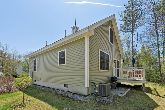 272 Mills Rd Unit 17, Kennebunkport, ME 04046 - view of property exterior featuring cooling unit, a wooden deck, crawl space, and a yard