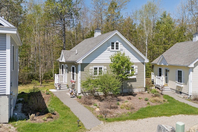 272 Mills Rd Unit 17, Kennebunkport, ME 04046 - view of front of house featuring a chimney