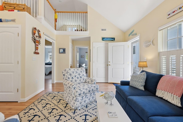 272 Mills Rd Unit 17, Kennebunkport, ME 04046 - living room with light wood-style flooring, high vaulted ceiling, and baseboards