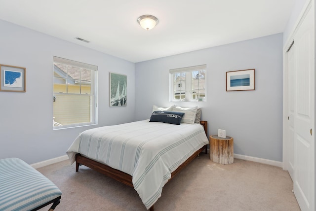 272 Mills Rd Unit 17, Kennebunkport, ME 04046 - carpeted bedroom with a closet, multiple windows, and baseboards