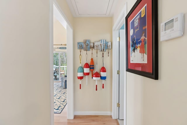 272 Mills Rd Unit 17, Kennebunkport, ME 04046 - corridor featuring wood finished floors, baseboards, and attic access