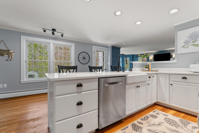 70 Summer St, Kennebunk, ME 04043 - kitchen with dishwasher, a sink, crown molding, white cabinets, and light countertops