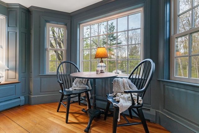 70 Summer St, Kennebunk, ME 04043 - dining room with light wood-style floors and a baseboard heating unit