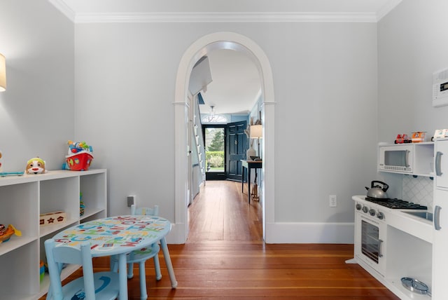 70 Summer St, Kennebunk, ME 04043 - game room with hardwood / wood-style floors, crown molding, baseboards, and arched walkways