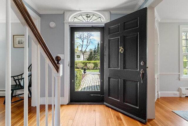 70 Summer St, Kennebunk, ME 04043 - entryway with light wood-style floors, crown molding, and stairway
