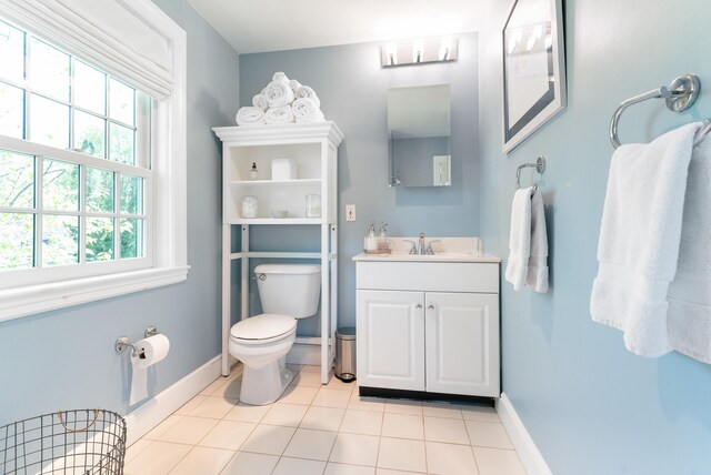 70 Summer St, Kennebunk, ME 04043 - bathroom with toilet, tile patterned floors, vanity, and baseboards