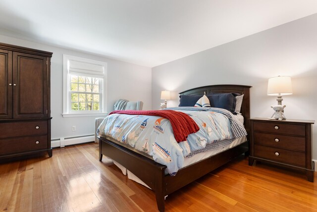70 Summer St, Kennebunk, ME 04043 - bedroom featuring baseboard heating and light wood-style flooring