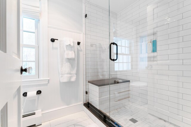 70 Summer St, Kennebunk, ME 04043 - full bathroom featuring marble finish floors, a stall shower, and a baseboard heating unit