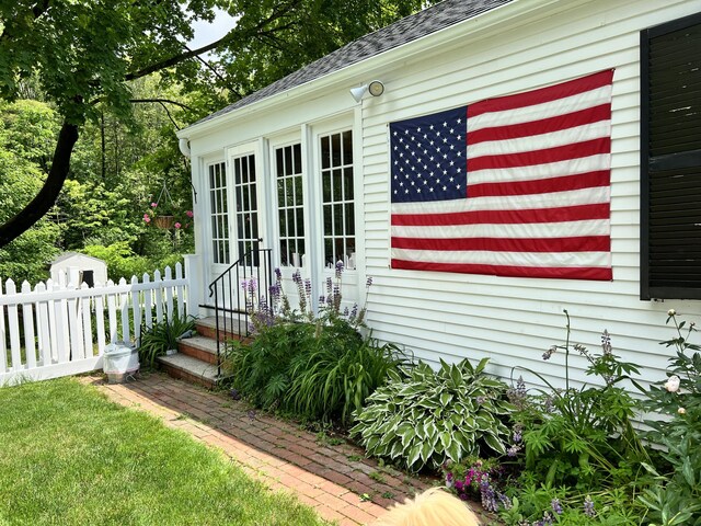 70 Summer St, Kennebunk, ME 04043 - property entrance featuring fence and a shingled roof