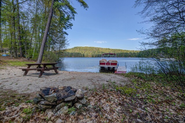 347 Brownfield Rd, Porter, ME 04068 - dock area featuring a water view and a forest view