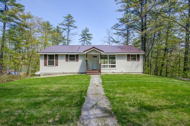 347 Brownfield Rd, Porter, ME 04068 - ranch-style house with a front lawn and metal roof