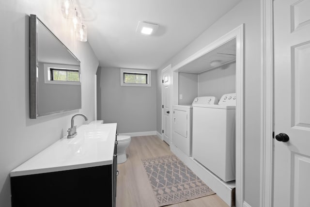 347 Brownfield Rd, Porter, ME 04068 - washroom with washer and dryer, light wood-style flooring, a sink, and baseboards