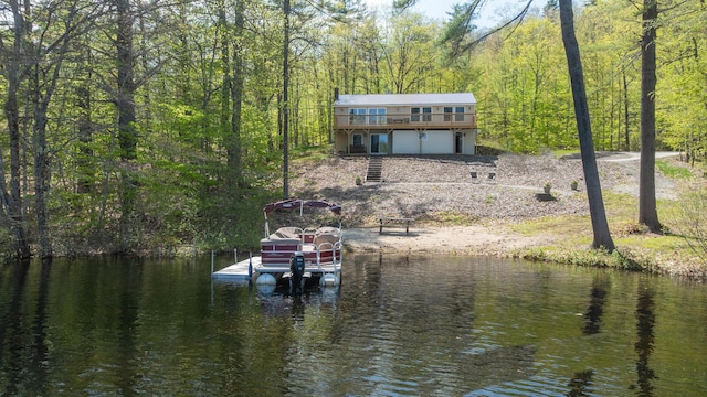 347 Brownfield Rd, Porter, ME 04068 - dock area featuring a view of trees, a deck with water view, and boat lift