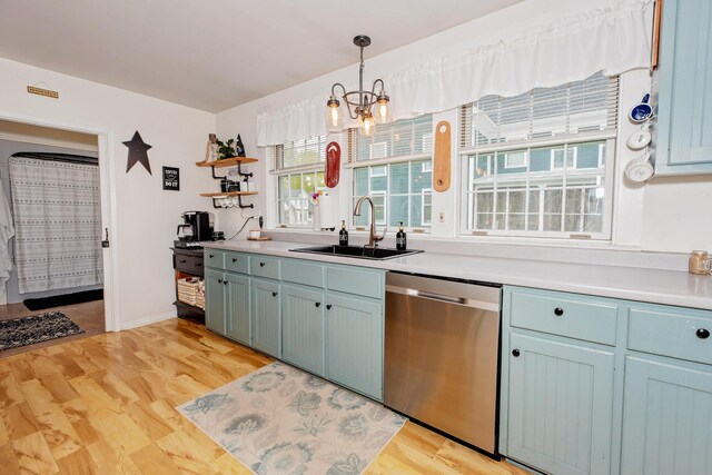 22 Pleasant St, Phillips, ME 04966 - kitchen with stainless steel dishwasher, a sink, open shelves, light countertops, and decorative light fixtures